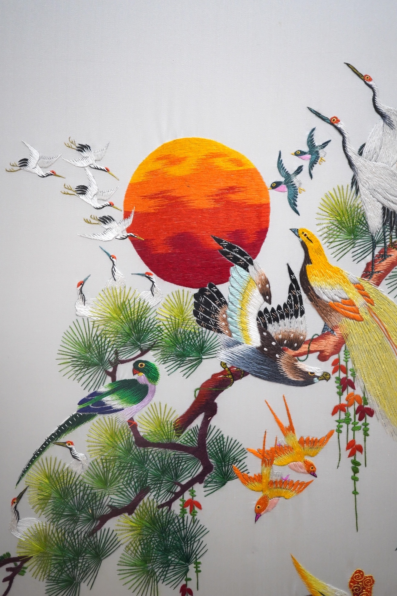 A modern Chinese embroidery on silk depicting birds of paradise, signed with character marks, 120 x 67cm. Condition - good